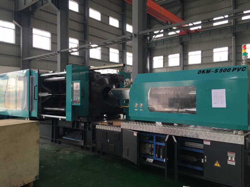SINO MOULD & DKM: PVC pipe fitting injection molding machine supplier
