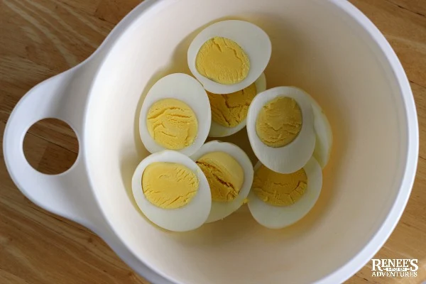 Hard boiled eggs in a white bowl