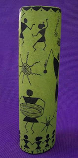 Warli painting on a recycled vase. warli motifs in celebration mood