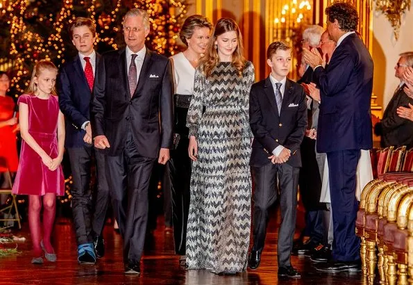 Crown Princess Elisabeth wore a long dress by ba&sh. Queen Mathilde wore a jupsuit by Natan. Princess Eleonore, Princess Astrid