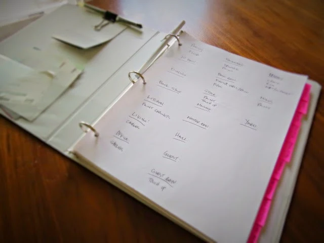 writing out to-do list in a binder
