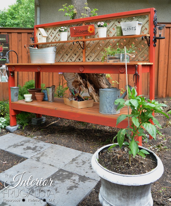 This simple DIY Gardener's Potting Bench can be built in an afternoon with 2x4s. A potting table by day and outdoor bar with solar lights at night.