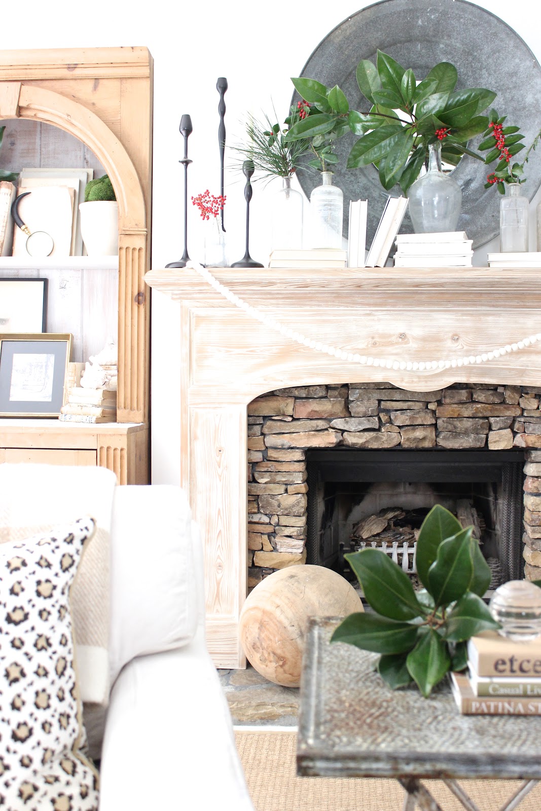 Modern rustic charm and coastal Christmas spirit in a living room by Sherry Hart.