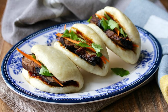 Bao Buns with picked vegetables and filled with char sui Bao Buns with picked vegetables and filled with char sui
