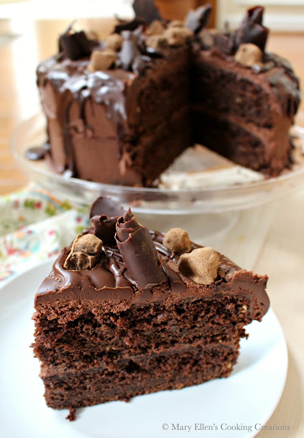 This cake is a chocolate lover's dream - a rich, double-layer chocolate cake with a creamy, whipped ganache. The cake is dressed with hazelnuts that have been toasted, candied, coated in tempered chocolate and rolled in Dutch cocoa powder, and with fancy bittersweet chocolate swirls.