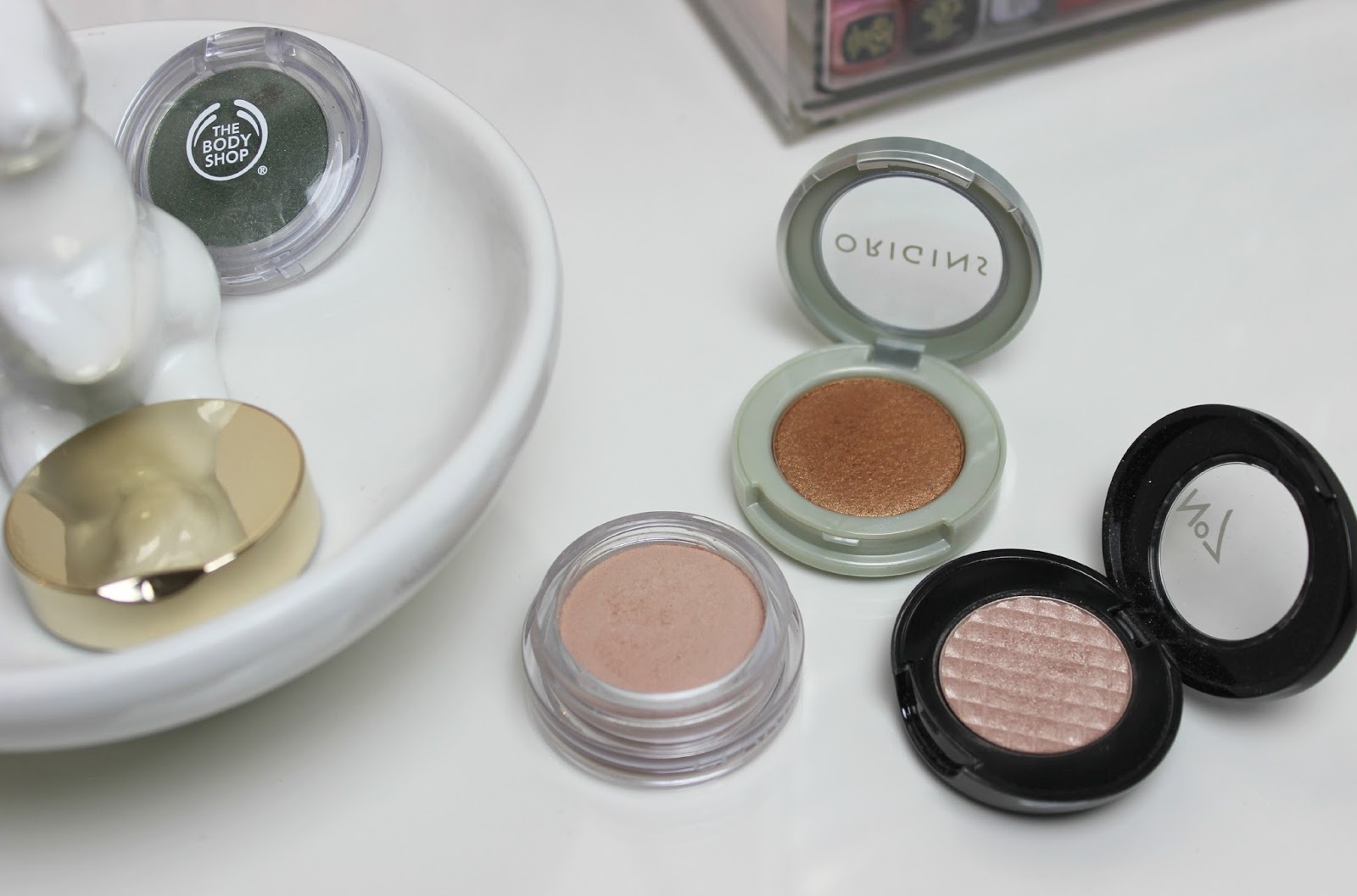 A picture of Origins Peeper Pleasers Powder Eye Shadow, No7 Stay Perfect Eyeshadow and Clarins Ombre Matte Cream-to-Powder Matte Eyeshadows