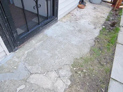 concrete walk broken back door yard