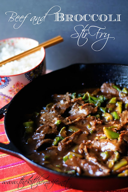 The finish beef and broccoli stir fry in a cast iron skillet with the title text above it and a bowl of rice to the side.  