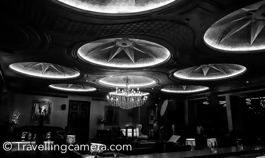 Few years back, one of my Photographer friends got this assignment to shoot LAP club in Hotel Ashoka. It was the time when club was renovated to host F1 party. Bollywood actor Arjun Rampal owns this club. This Photo Journey shares some of the photographs of this wonderful place in Delhi.LAP is an exclusive club which welcomes the members and it's memebership is invite only, and which is hard to get (it seems). I have not visited many of the Delhi clubs but whatever I have visited, LAP club is definitely the best I experienced. But recently I noticed LAP club on Zomato,  so wondering if it's open for all. And 2K for 2 folks including drinks sound quite reasonable. Let me figure out more and shareWhen it was renovated, every small things in the club was very well thought and designed. It seemed like things places inside the club is made for that  place only. Shahrukh's wife Gauri Khan has designed some of the furniture pieces of LAP club.Few years back I had shared these photographs in a Photo Journey and now sharing again after re-processing. I love re-processing my photographs. That teach you a lot about your mistakes done in the past and give a refresher on how to avoid those mistakes in future.Some of the most exclusive night parties are organized at LAP. They frequently post their events in their facebook , so you may want to check out more details there.Here is a photograph which shows one of the entry to LAP club. There are two entries to the club. One is from Ashoka hotel lobby and another is exclusive entry for the club from main roadClub has seating arrangements outside as well. Many times, club organizes screening of Cricket or Football worldcup and these screenings happen outside.The beautiful fountain which looked absolutely stunning with these lights.There are these beautiful lamps hanging outside the club and they adds to the mode of evening at Lap club.