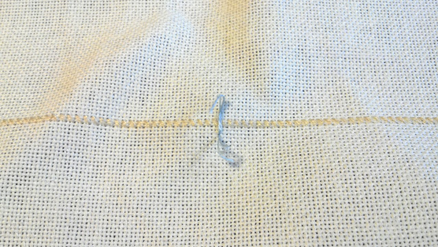 Loose placekeeper stitch placed at halfway point to keep track when I move my hoop