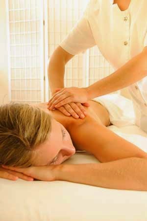 Woman receiving a massage after starting her exercise program