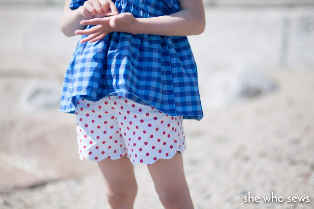 White shorts with pink spots Blue gingham top at the beach