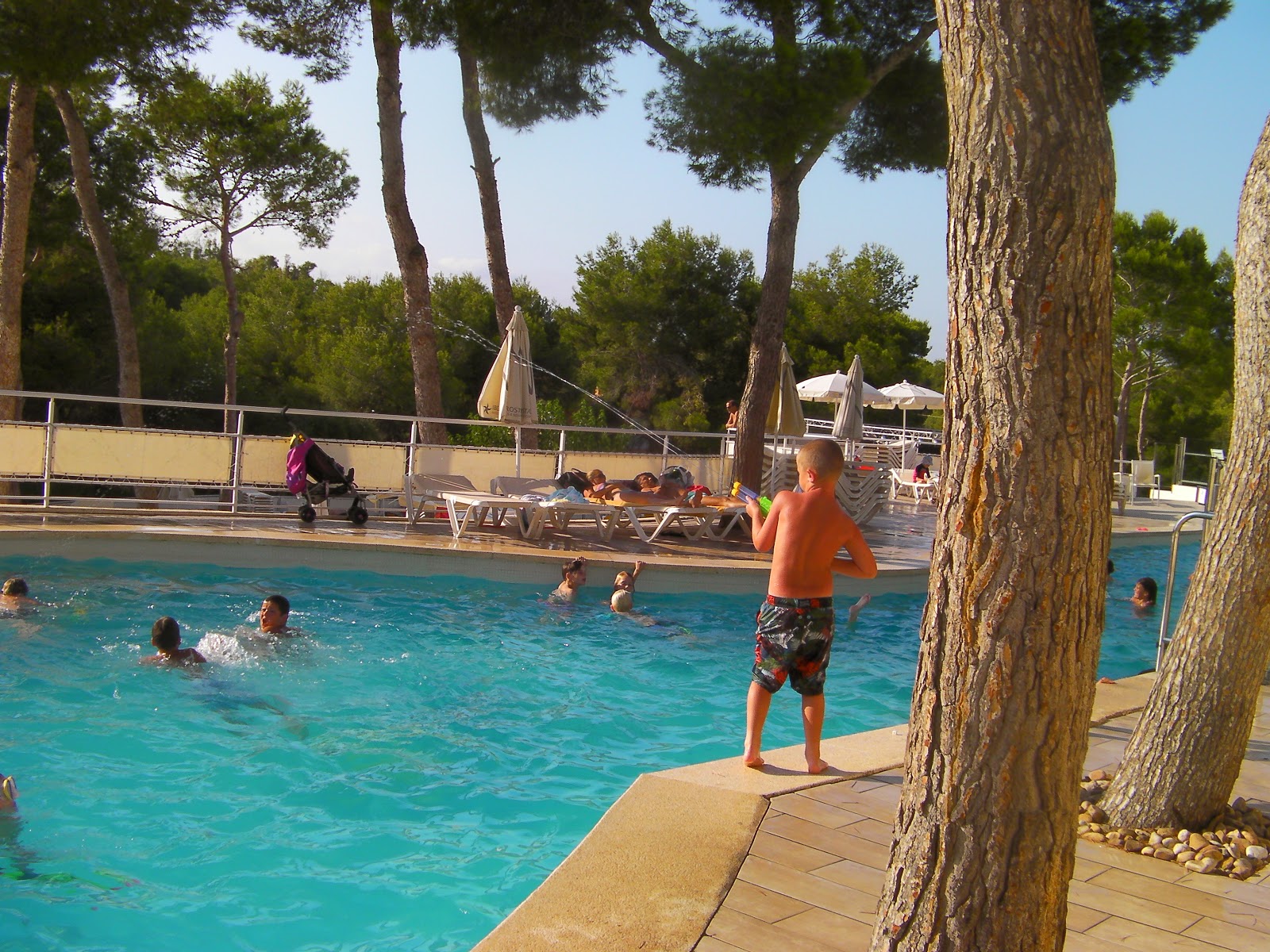 cala barca main hotel pool all- inclusive cala barca por6 boy with giant water squirter