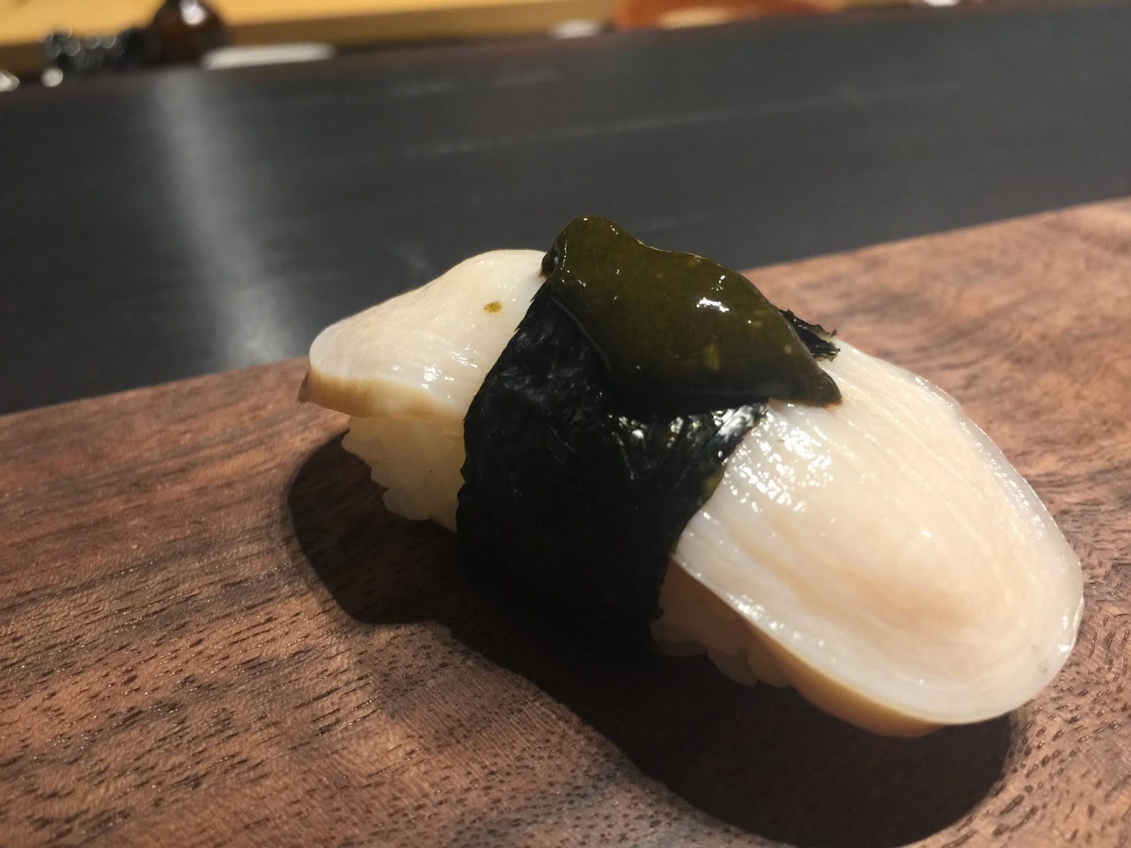 Ikura (salmon roe) with a jellied broth underneath. A bit like the effect of Xiaolongbao.