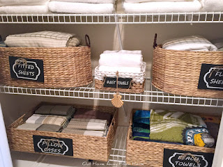  easy linen closet organization with baskets and labels