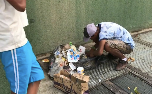 Warding off hunger, Venezuelans find meals in garbage bins