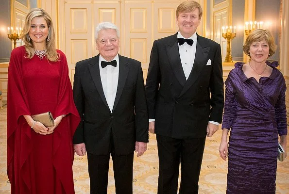 Queen Maxima and aniela Schadt attend a dinner Noordeinde Palace. Queen Maxima wore VALENTINO Silk Dress. Maxima wore diamond necklace and diamond earrings, Sergio Rossi Pumps