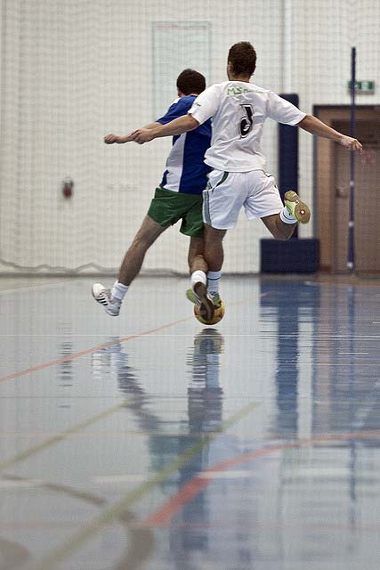 Playing futsal.
