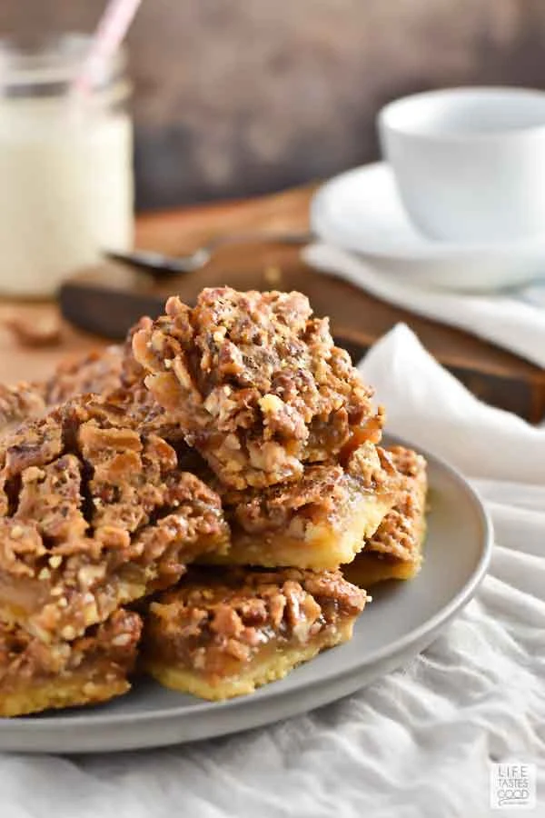 Plate of the best pecan pie bars on a table ready to eat
