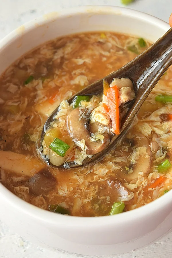 Hot & Sour Soup with eggs,carrots,mushrooms and green onions
