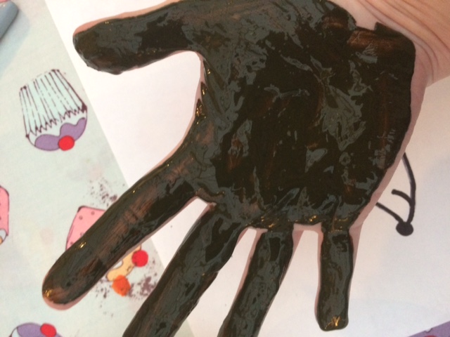 Hand covered in paint