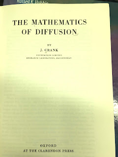 Title page of The Mathematics of Diffusion, by Crank, superimposed on the cover of Intermediate Physics for Medicine and Biology.