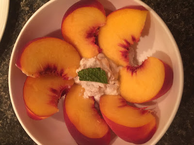 Peaches served with coconut whip cream