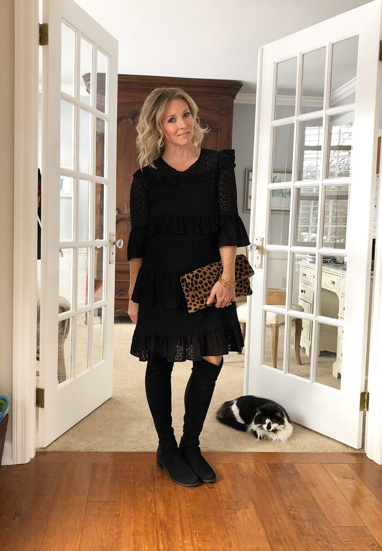 black lace dress with over the knee boots and a leopard clutch