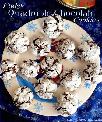 Fudgy Quadruple Chocolate Cookies are made with four different chocolates, rolled in confectioner’s sugar and baked to fudgy perfection. | Recipe developed by www.BakingInATornado.com | #recipe #cookies