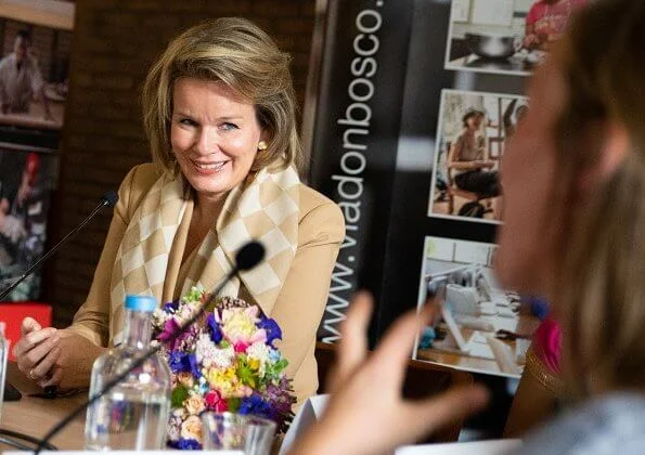 Queen Mathilde wore a beige pantsuit by Natan. Global Education Conference organized by VIA Don Bosco