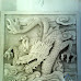 relief motif naga batu alam paras jogja