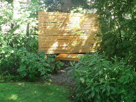 Zen cedar bench and cedar privacy screen in a quiet corner by garden muses: a Toronto gardening blog 