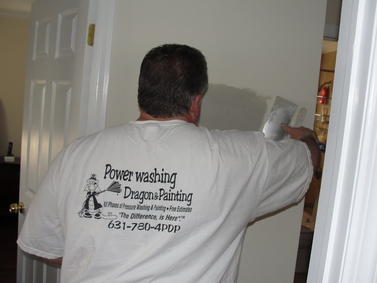 Ed using tape and spackle to make drywall repairs, Long Island NY