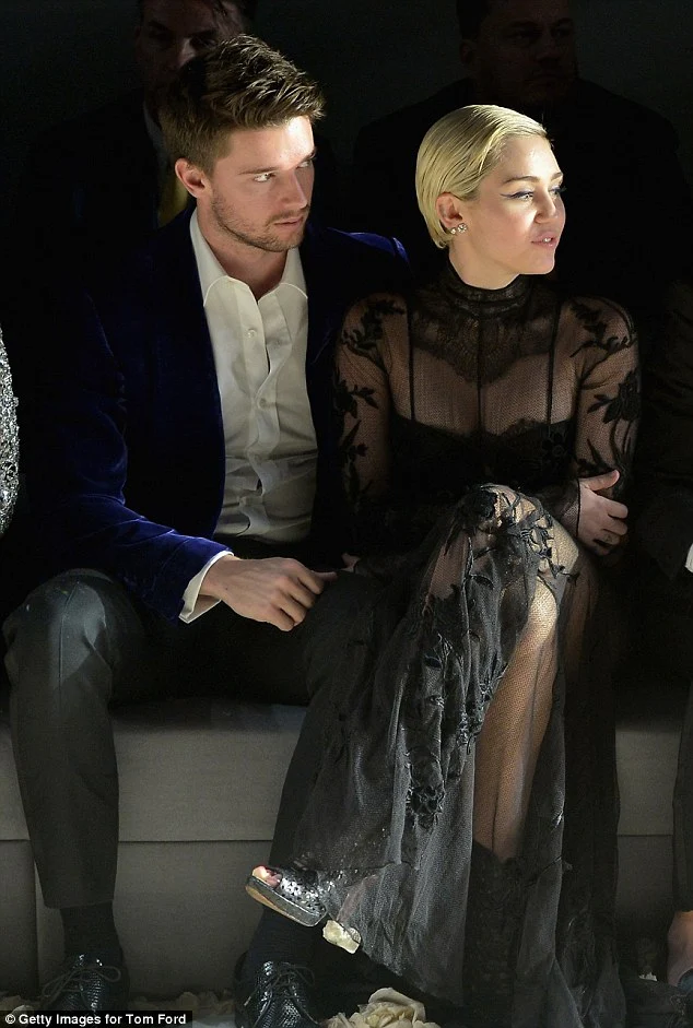 Miley Cyrus stuns in a sheer lace gown at the Tom Ford Fall/Winter 2015 Fashion Show in LA