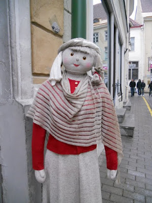 Plush model showcasing a shawl in Tallinn, Estonia