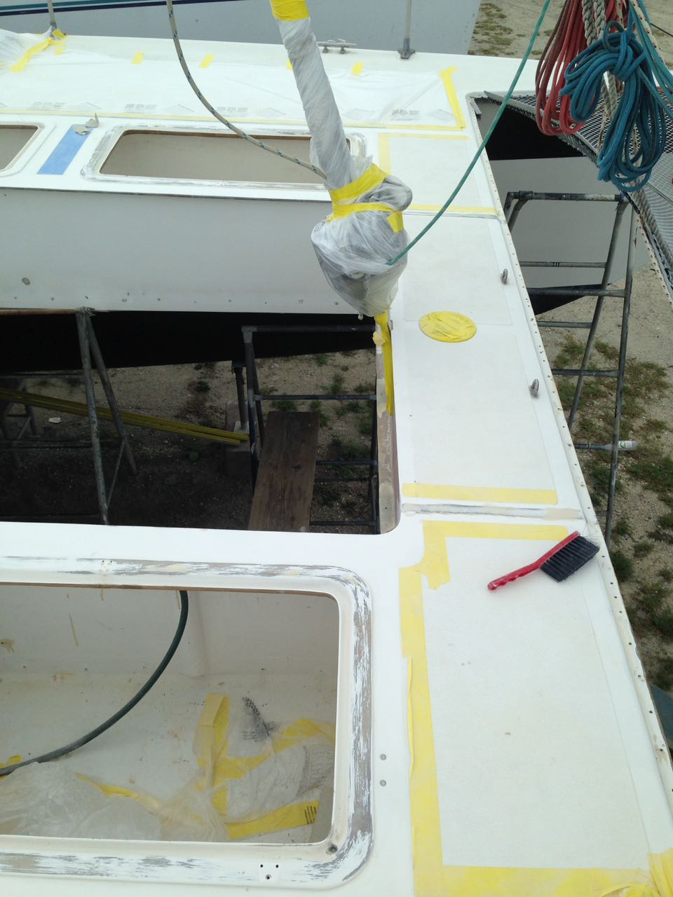 S/Y RAPTOR Spray Painting Our Deck