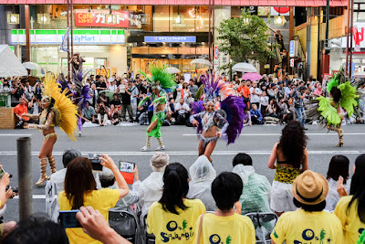 Passista dancers at 2016 Asakusa Samba Carnival, Tokyo, Japan. Feathered passistas dance at 2016 Asakusa Samba Carnival, Tokyo, Japan.