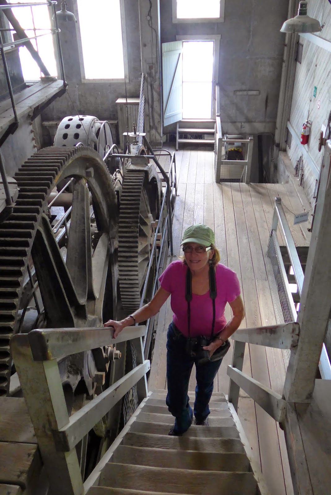 Liz walking up the stairs inside the dredge.