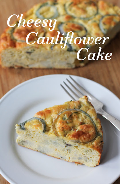 Food Lust People Love: Cheesy Cauliflower Cake has tender cauliflower florets in a thick Parmesan-rich batter, baked to golden perfection. A deliciously pretty vegetarian main course the whole family will love.