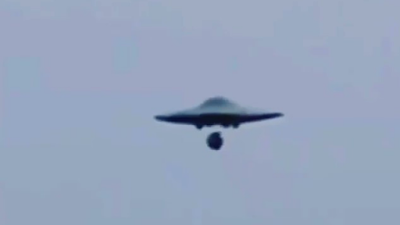 Another metallic looking UFO but a Mothership releasing a UFO Drone. Another metallic looking UFO but a Mothership releasing a UFO Drone.