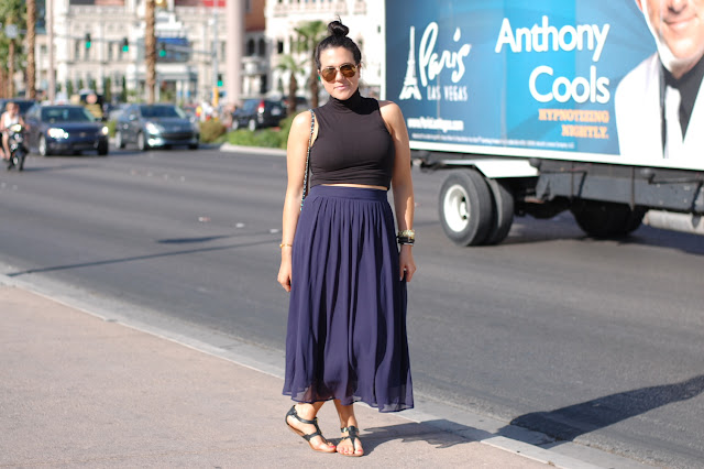 Blue midi skirt, black crop top from Sirens, Aldo gladiator sandals and a Chanel caviar classic bag.