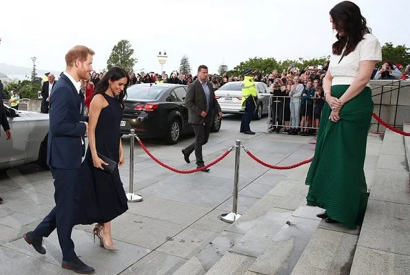 Meghan Markle wore Antonio Berardi breasted sleeveless dress, Aquazzura Deneuve pumps, and Dior clutch