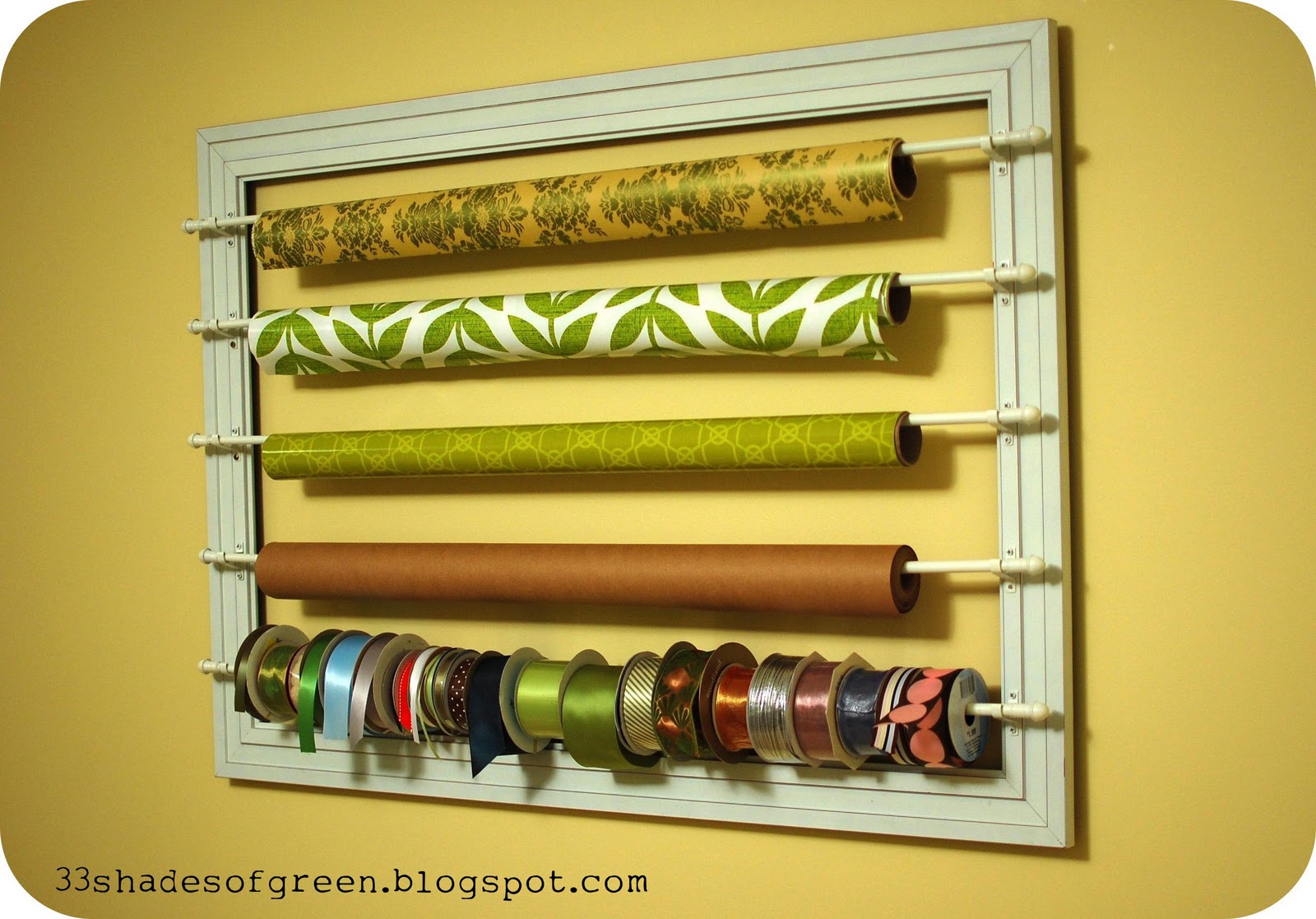 Wrapping paper and ribbon storage outlet