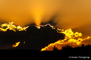 Cramer Imaging's professional landscape photograph of a dramatic orange sunset with clouds in silhouette in Tetonia, Teton, Idaho