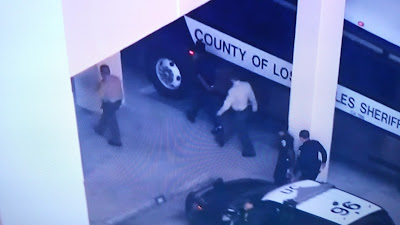 P Diddy arrested in handcuffs and led away by Los Angeles police.