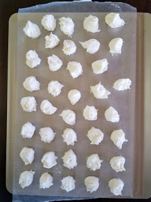 balls of creamy centers scooped onto wax paper and ready to freeze
