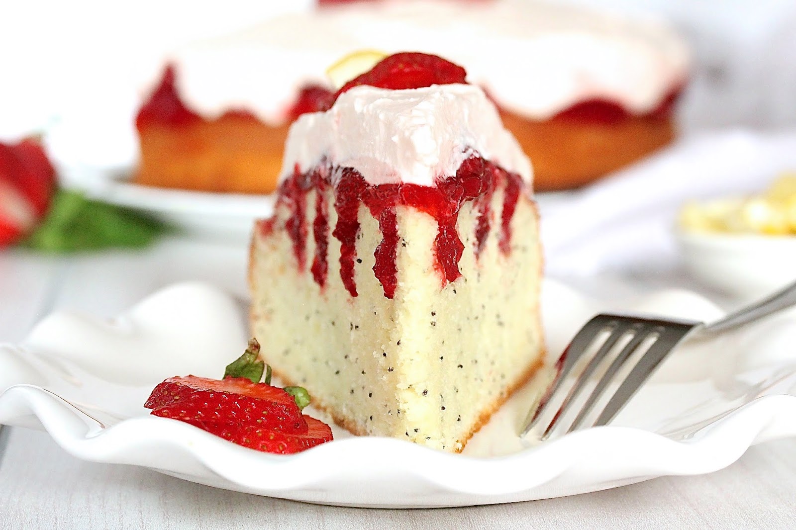 POPPY SEED STRAWBERRY POKE CAKE WITH PINK LEMONADE WHIPPED CREAM