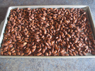 Baking sheet filled with cinnamon almonds cooling off
