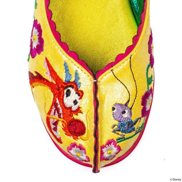 Irregular Choice So Hot, I'm Cool toe close up of toe of shoe in yellow with embroidered Cri Kee and Mushu figures from Mulan