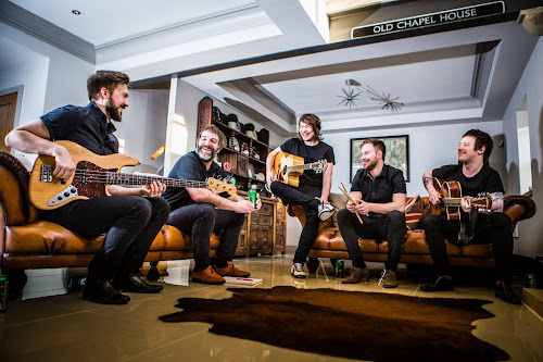 SuburbanSymphony_SeatedSmiling